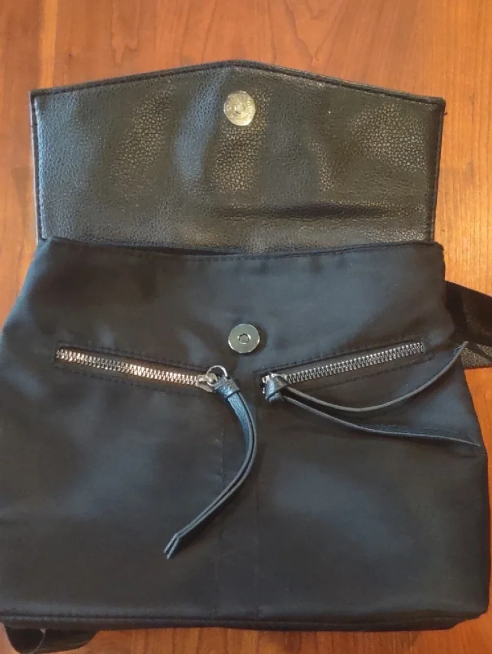 Botkier Black Backpack with Textured Flap, Adjustable Straps And Zip Pockets